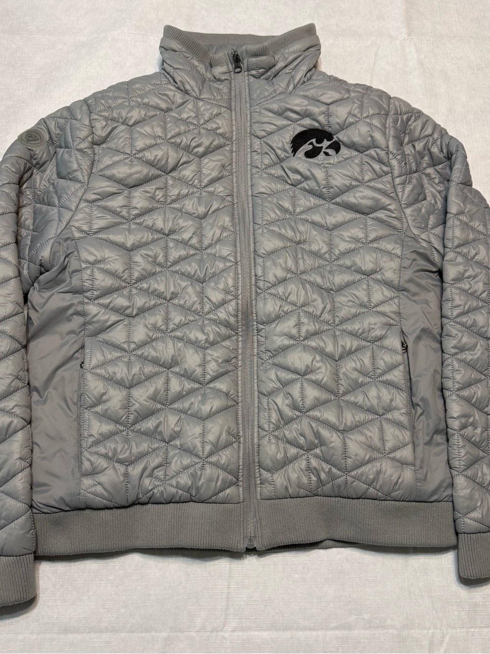 Colosseum Quilted Light Gray Puffer Jacket with Embroidered Iowa Hawkeye Logo